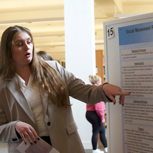 Student presentation her findings at the Student Symposium in May 2022