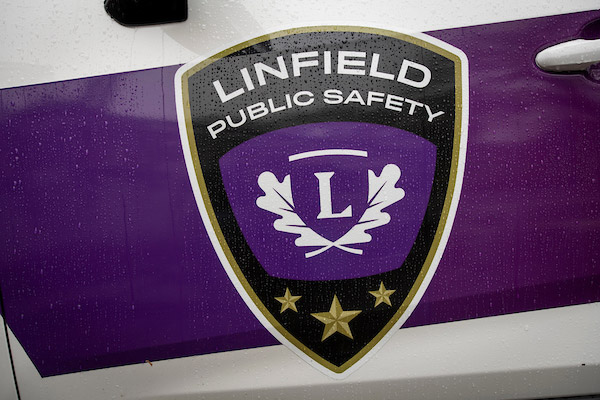 The LPS emblem on the side of the officer vehicle.