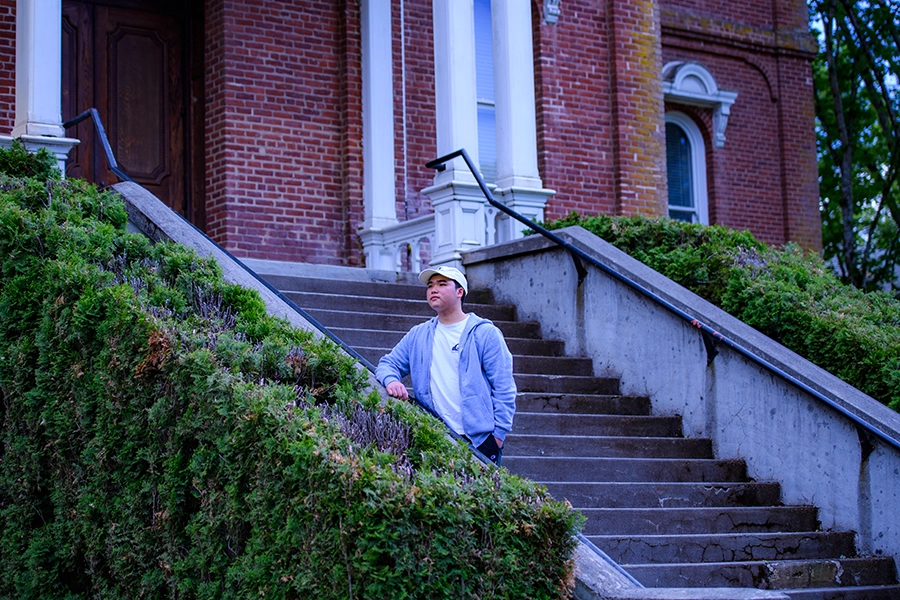 Song standing on the steps of Pioneer Hall.