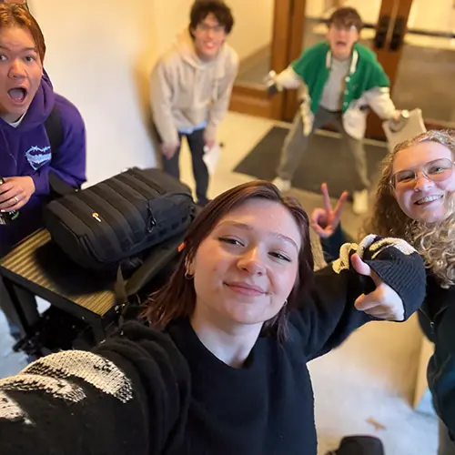 Sydney taking a selfie with her team.