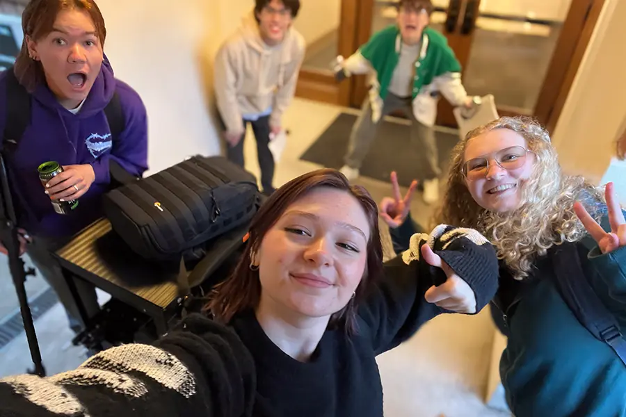 Sydney taking a selfie with her team.