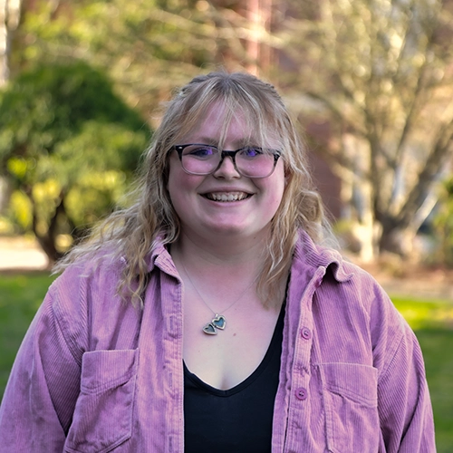Portrait of Caitlin outside.