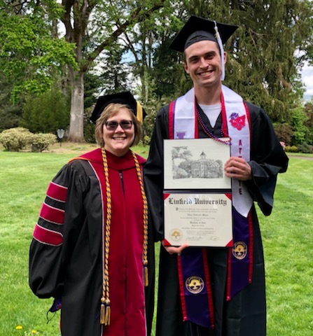 Ethan Myers at 2021 graduation with Linfield's professor Lisa Weidman