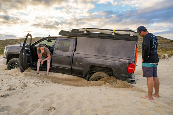 Liam Pickhardt and friend's car stuck in the sand