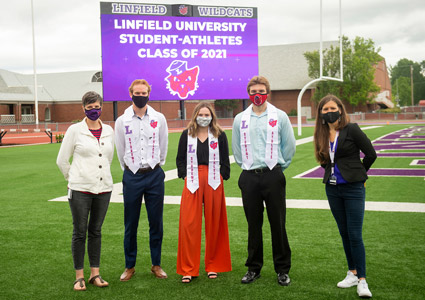 Jane Samuels and Natalie Welch pictured with WildX student contributors, Keaton Wood, Madison Reimer and Andy Starkel at a 2021 Commencement ceremony.