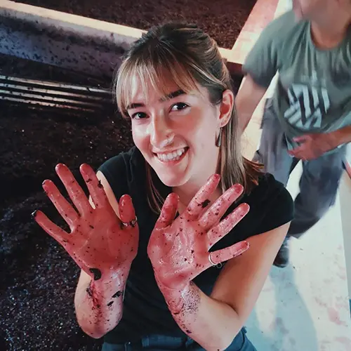 Emma Anderson showing messy hands from the winemaking process.