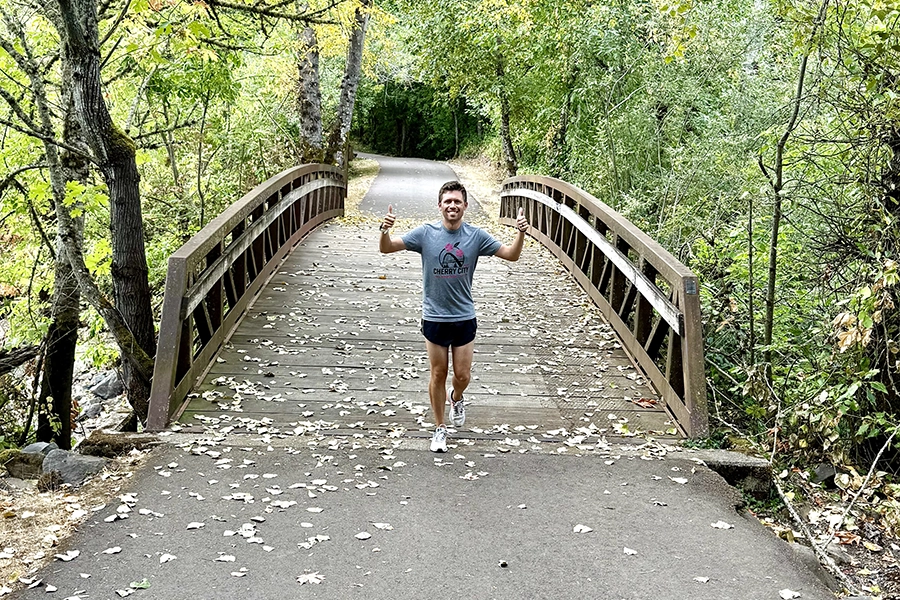 Alex running over a bridge in Salem.