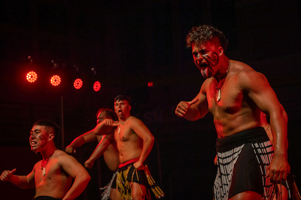 A dance performance with male students.