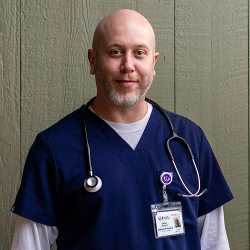 portrait of Zach Diamond '22 in his scrubs