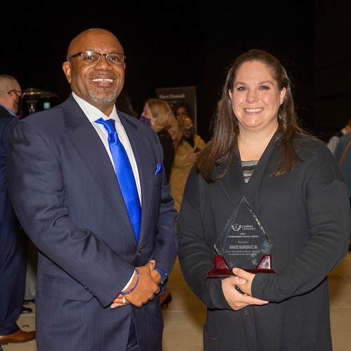 President Miles K. Davis with Ashley (Russell) Blatchley '06, recipient of the The Lloydena Grimes Award for Nursing Excellence in 2021.