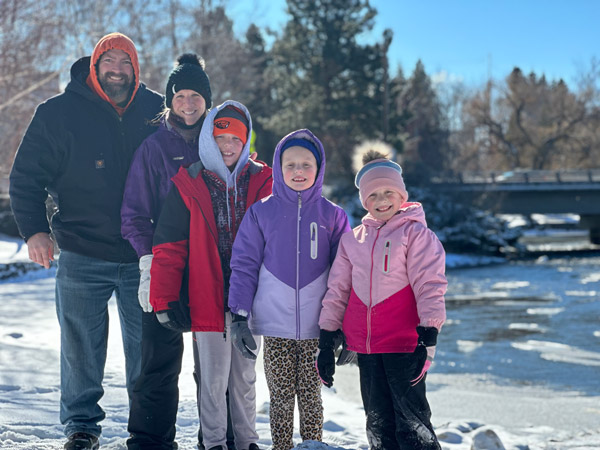 Chris Miles '06 and his family in the snow.