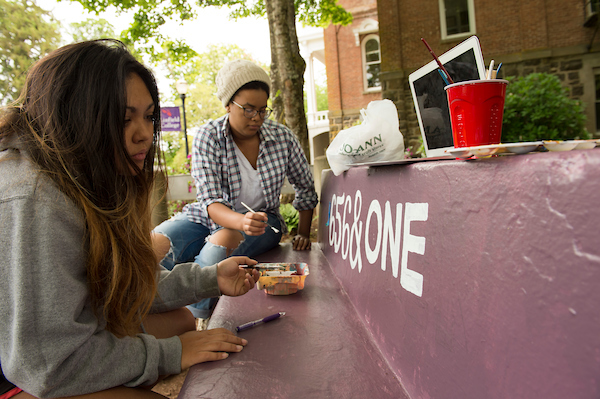 Seniors painting the bench in 2017