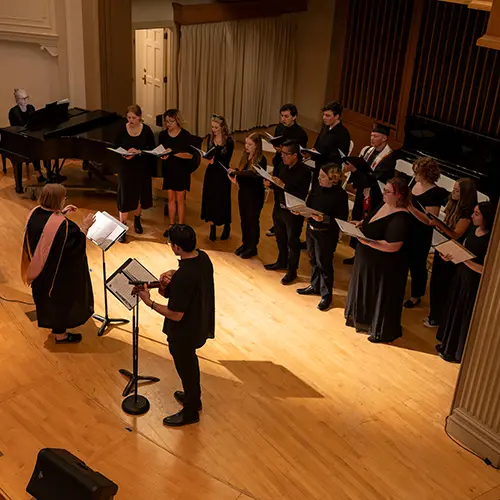 students singing on stage.