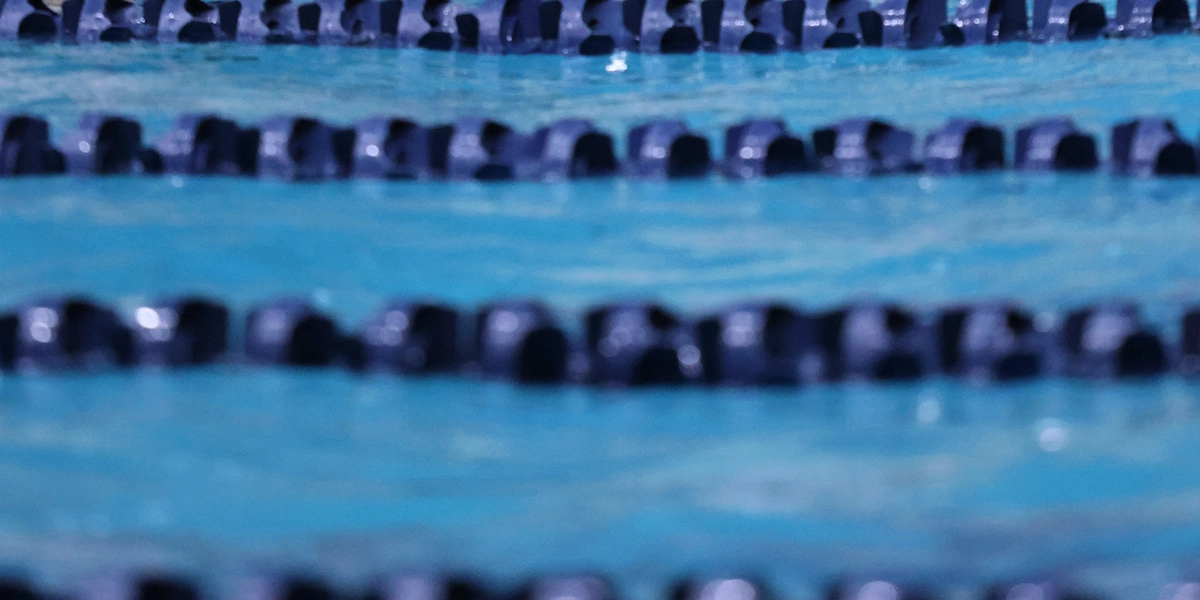 Close up of empty swimming lanes in a pool.