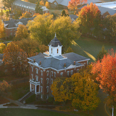 an aerial view of Pioneer Hall on an early fall morning
