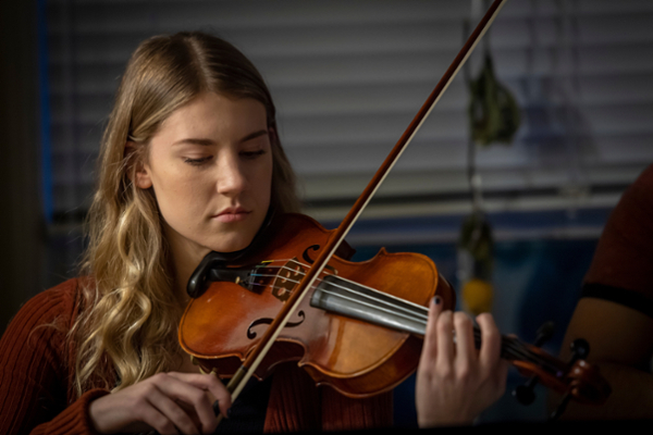 Linfield student playing violin