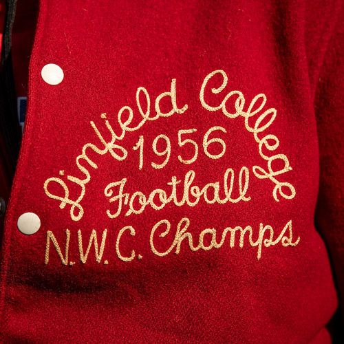 Letterman jacket embroidered with "Linfield College 1956 Football NWC Champs"