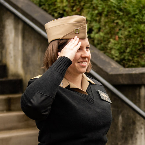 female Navy officer saluting
