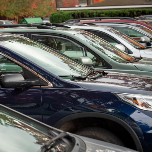 line of cars in a lot.