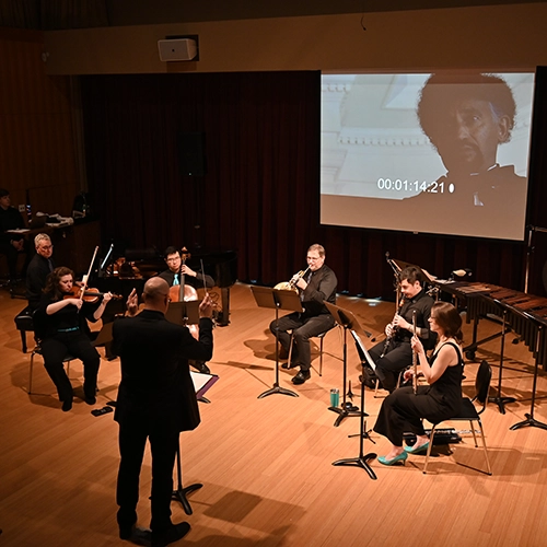 The LCME performing for a film piece.