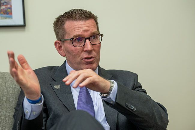 Mark Blegen sits with his legs crossed