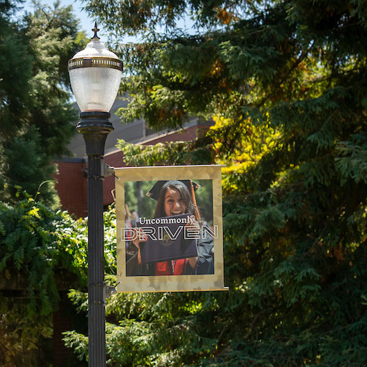 Uncommonly Driven banner on campus