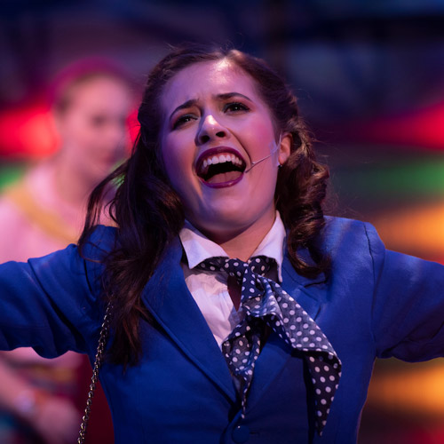 Student singing in Heathers musical