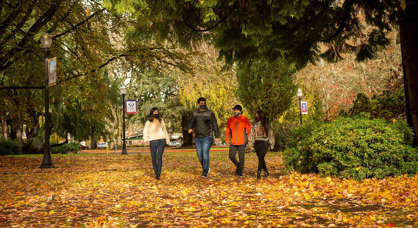 international students walking through academic quad