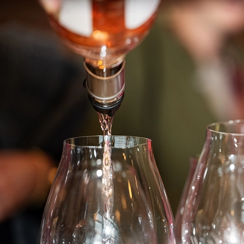 stock photo of wine pouring into a glass.